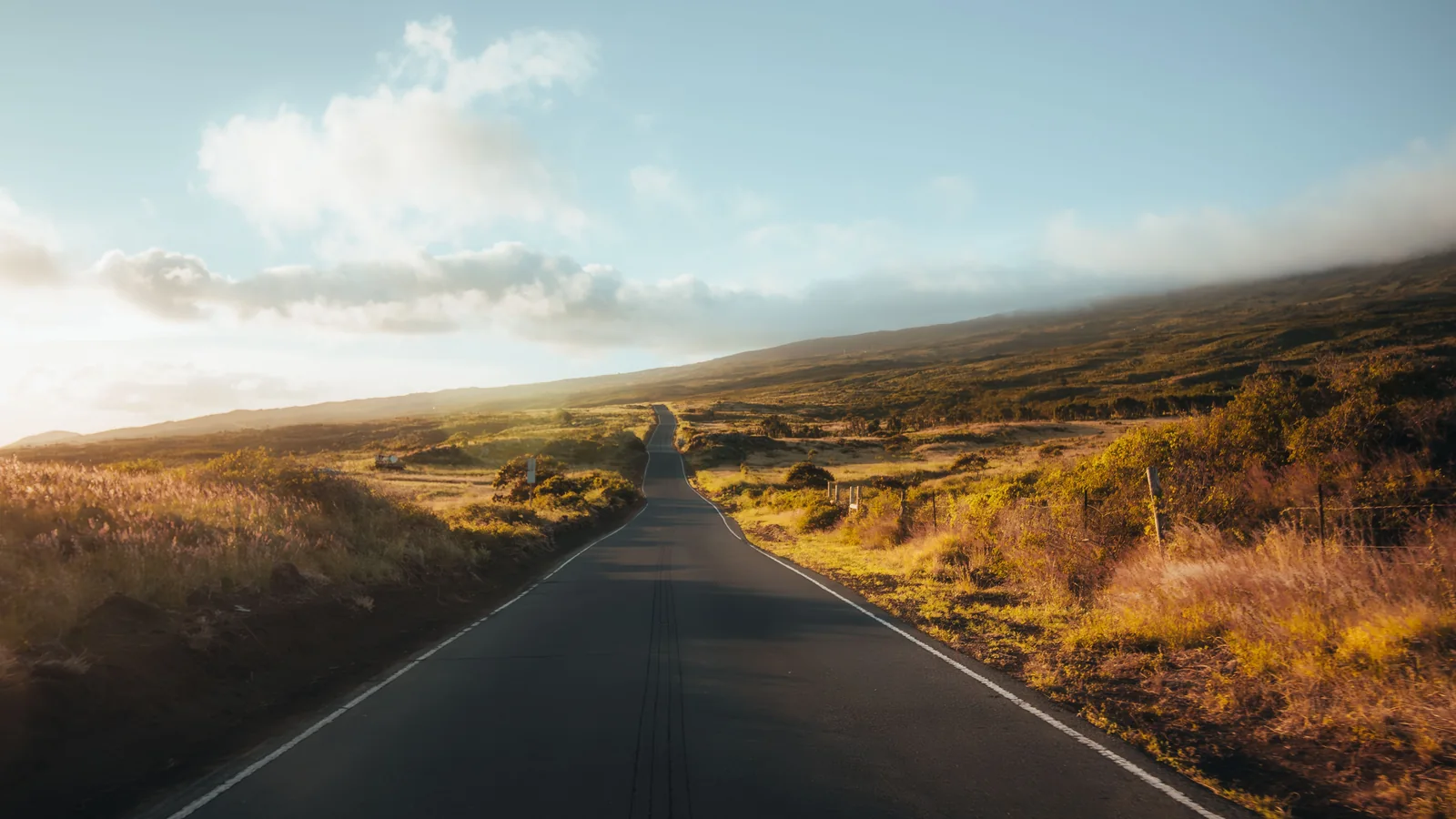 Paved Maui countryside road leading toward Haleakalā